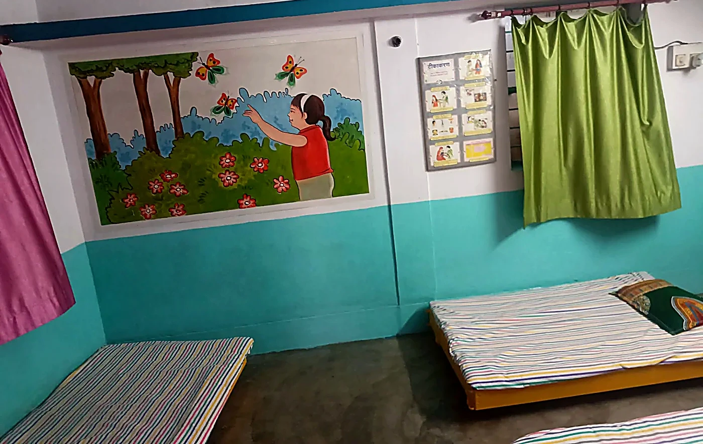 Calm nap room with colourful butterfly and girl mural